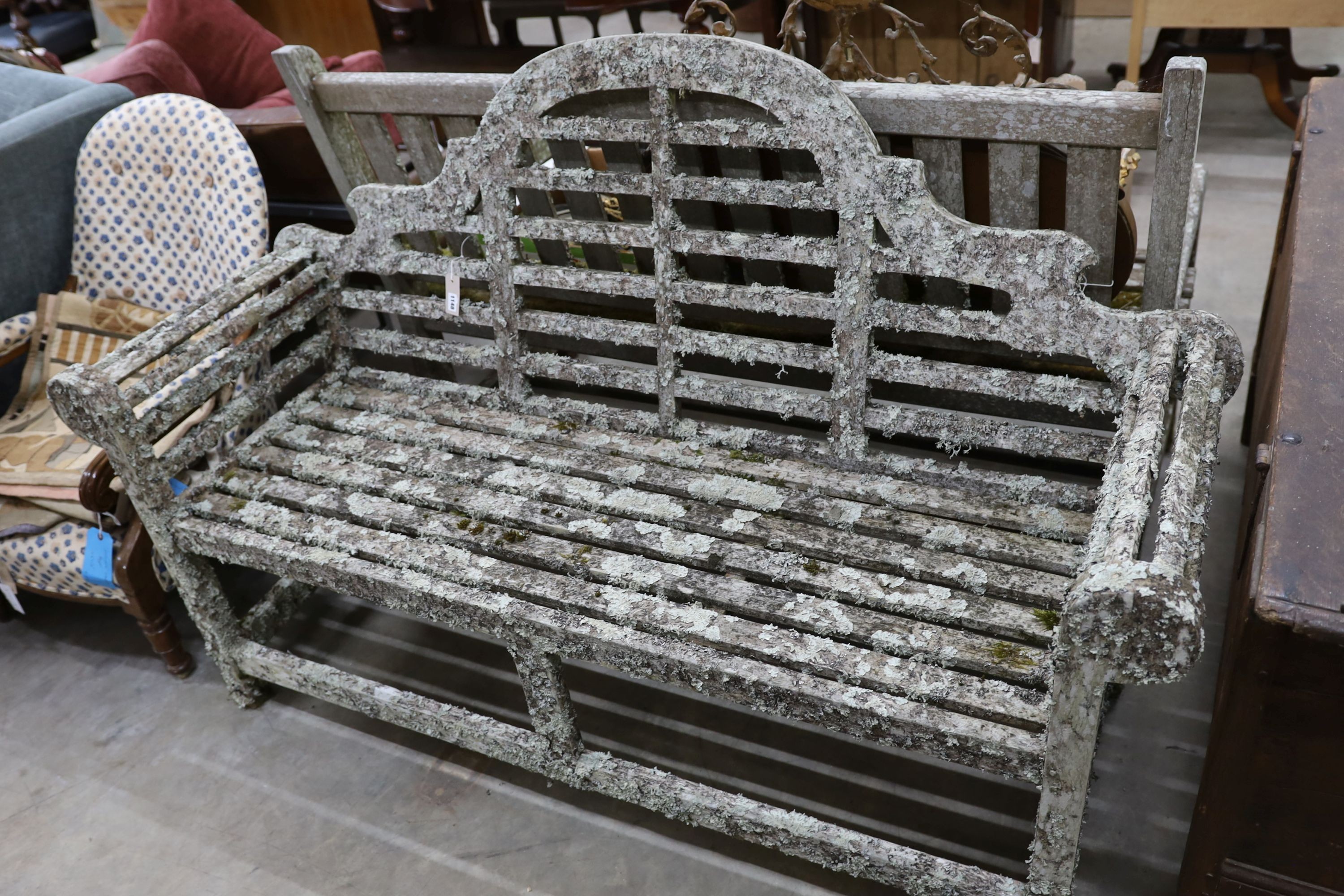 A Lutyens style lichen covered teak garden bench, length 160cm, depth 52cm, height 102cm